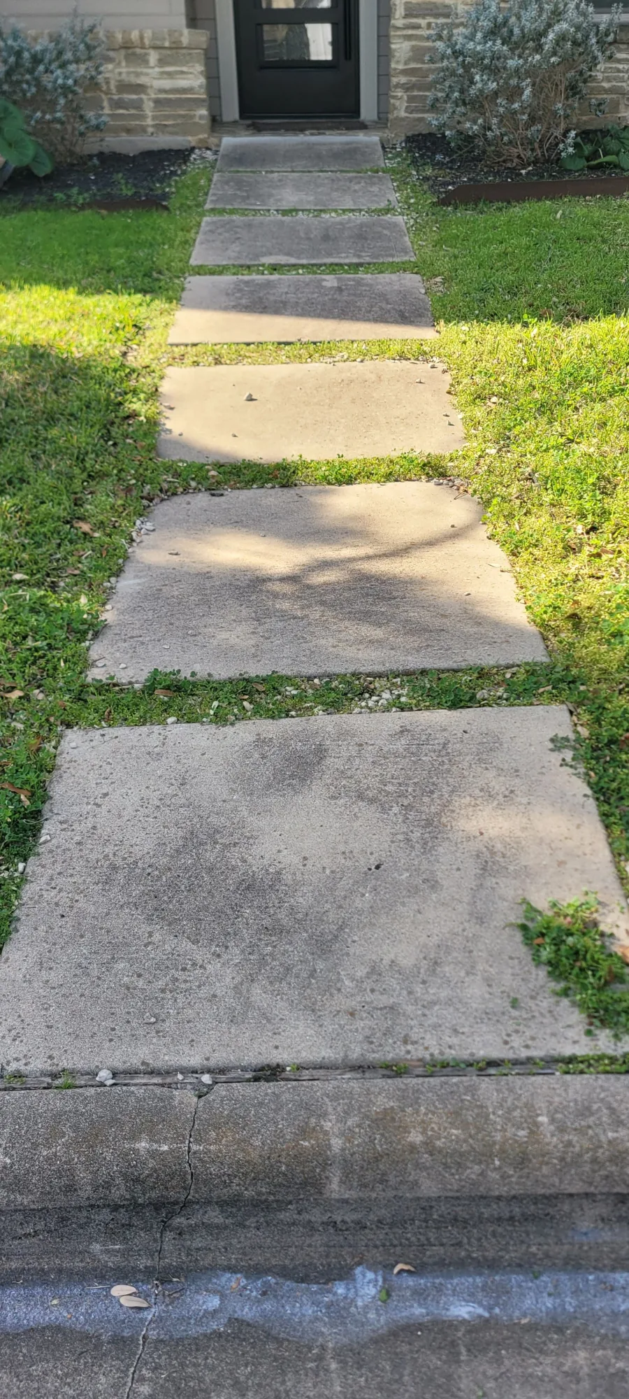 Concrete walkway stained and dirty before pressure washing